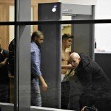 Justin Bieber was seen once again going shirtless as he stepped through a security gate at Wladyslaw Reymont Airport in Lodz, Poland
