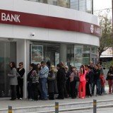 Laiki Bank, Cyprus' second-biggest, will be wound down and holders of deposits of more than 100,000 euros will face big losses after Eurogroup agreed on bailout