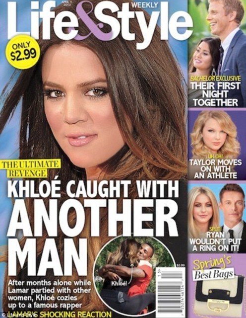 Life & Style magazine shows a picture of Khloe Kardashian jumping into The Game's arms in LA's Runyon Canyon Park last month
