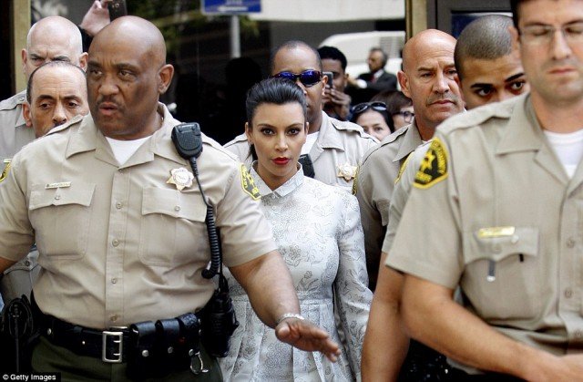 Kim Kardashian was escorted out of Los Angeles court house flanked by ten sheriffs
