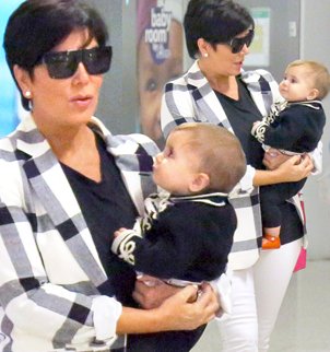 Kris Jenner carries granddaughter Penelope Disick through Greek airport