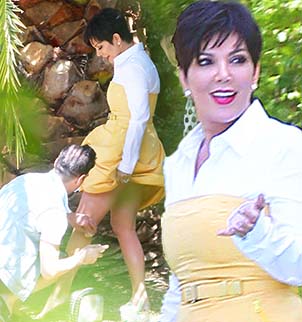 Kris Jenner was snapped having her legs touched up with what appeared to be spray tan while on a photoshoot
