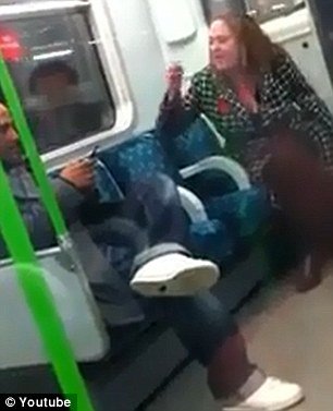 London police is haunting a woman who launched a tirade of foul-mouthed racist abuse towards another passenger on an eastbound District line train