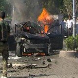 Syrian PM Wael al-Halqi has survived a car bomb attack targeting his convoy in western Mazzeh district of Damascus
