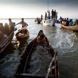 A boat carrying about 200 Rohingya Muslims has capsized off western Burma