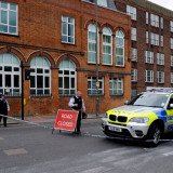 A man has been killed in a machete attack and his two assailants shot by police in Woolwich, south-east London