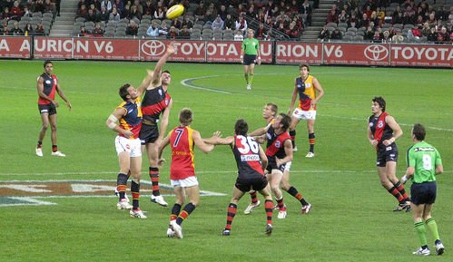 Australian Rules Football is a physical contact sport that is described as a cross between rugby and football