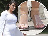 Heavily pregnant Kim Kardashian's feet were so swollen that she barely managed to squeeze them into the footwear
