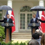 Hosting Turkish PM Recep Tayyip Erdogan in the Rose Garden, President Barack Obama requested a standing Marine to open an umbrella and protect his head from the light rain
