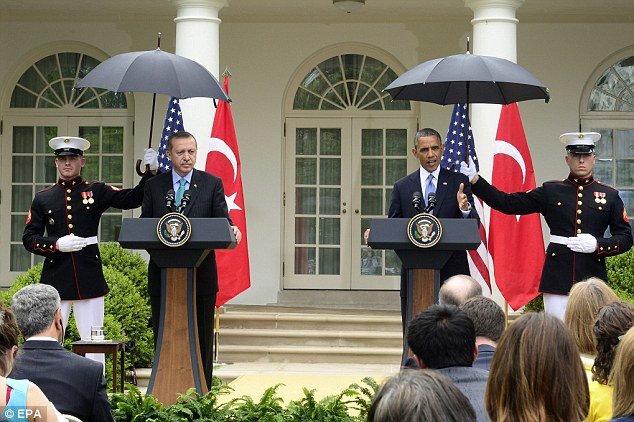 Hosting Turkish PM Recep Tayyip Erdogan in the Rose Garden, President Barack Obama requested a standing Marine to open an umbrella and protect his head from the light rain
