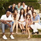In the just-released family photo promoting the upcoming season of KUWTK, Khloe Kardashian is seated next to her husband Lamar Odom