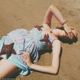 Ireland Baldwin's latest series of Twitter pictures show the teenage model with three live starfish placed on her while she reclines on a beach