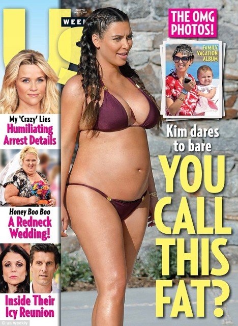 Kim Kardashian shows off her blossoming baby bump in a bikini as she proves fat critics wrong