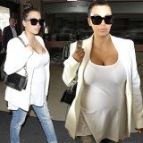 Pregnant Kim Kardashian drew attention to herself as she arrived at LAX thanks to her low-cut top