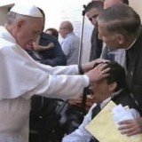 TV 2000 images show a man apparently reacting to Pope Francis putting his hands on his head