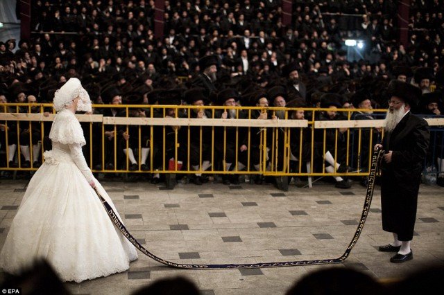 Tens of thousands of Ultra-Orthodox Jews of the Belz Hasidic Dynasty watch the wedding ceremony of Rabbi Shalom Rokach