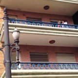The lover attempting to escape the cheating woman’s bedroom after her husband has come home