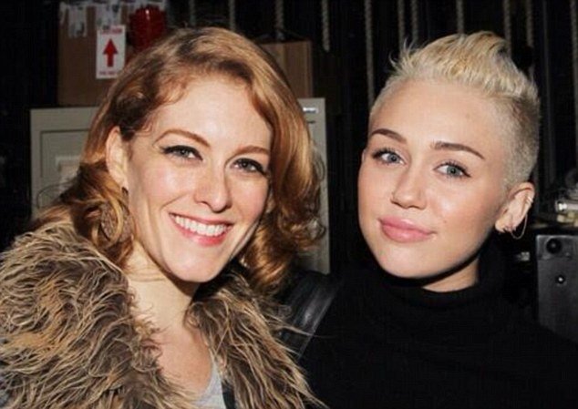 Dylis Croman has been identified as the mystery woman posing with Miley Cyrus in a cryptic Twitter post in which the singer gives her father Billy Ray a very public ultimatum