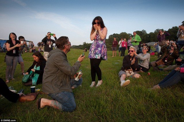 Glastonbury reveller Lee Nickleson gets down on one knee to propose girlfriend Ceilidh Jackson