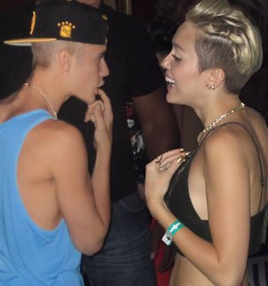 Miley Cyrus has denied rumors of a romance with Justin Bieber after they were pictured together at a club in LA