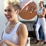 Miley Cyrus was very much displaying her 3.5 carat sparkler on the relevant engagement finger during a photo shoot in LA