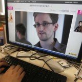 The British government has warned airlines not to allow Edward Snowden to fly to the UK