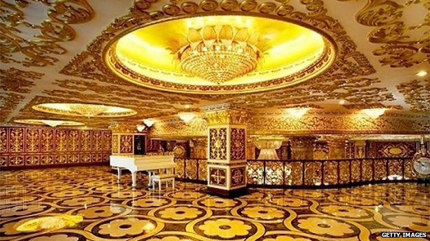 Chinese state-owned drug company building decorated to mimic France's Versailles palace, complete with gold-tinted walls and chandeliers
