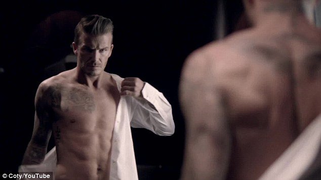 David Beckham reveals his athletic torso in ad for his new fragrance Classic
