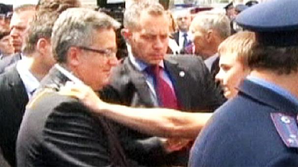 President Bronislaw Komorowski was attacked with an egg by a Ukrainian man when he visited the site of a 1943 massacre of Poles in Ukraine