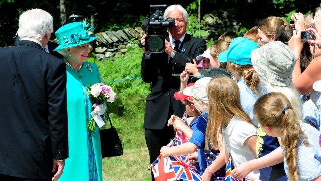  Queen Elizabeth II said she hopes Kate Middleton's baby is born soon, because she is due to go on holiday