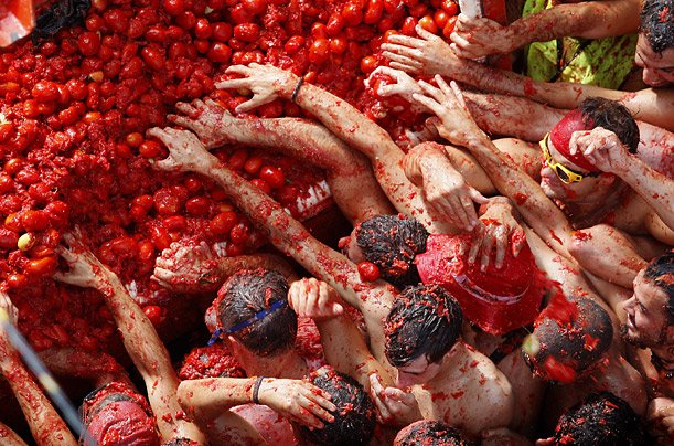 Each year thousands of tourists pack Bunol to take part in the hour-long tomato fight that leaves the streets running in red juice