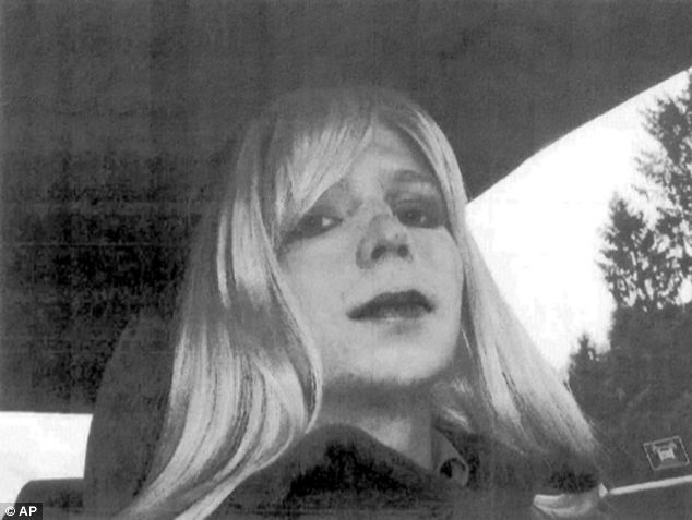 In this undated photo provided by the US Army, Bradley Manning poses wearing a wig and lipstick