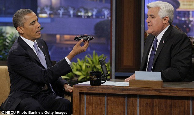 President Barack Obama giving Jay Leno a replica of his limo The Beast on The Tonight Show