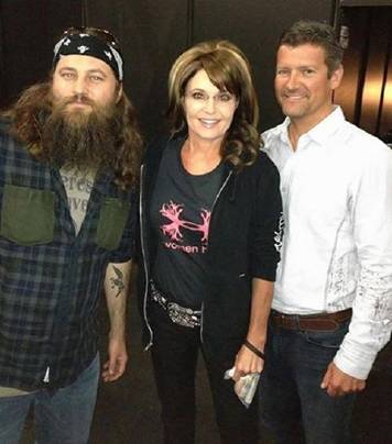 Sarah Palin and her husband Todd with Willie Robertson at the 2013 NRA convention