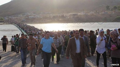 Thousands of Syrian refugees are pouring over the border into Iraqi Kurdistan