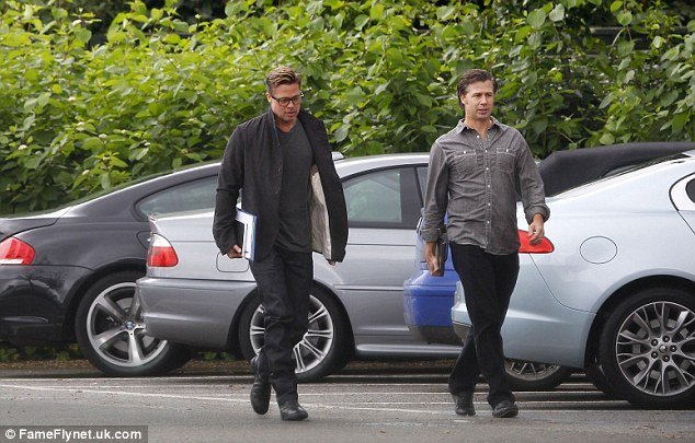Brad Pitt has revealed a new short haircut as he arrived on the set of his new film Fury in London