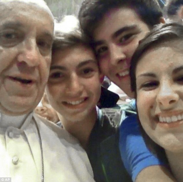 Pope Francis posed for a selfie with young Italian pilgrims in St Peter's Basilica