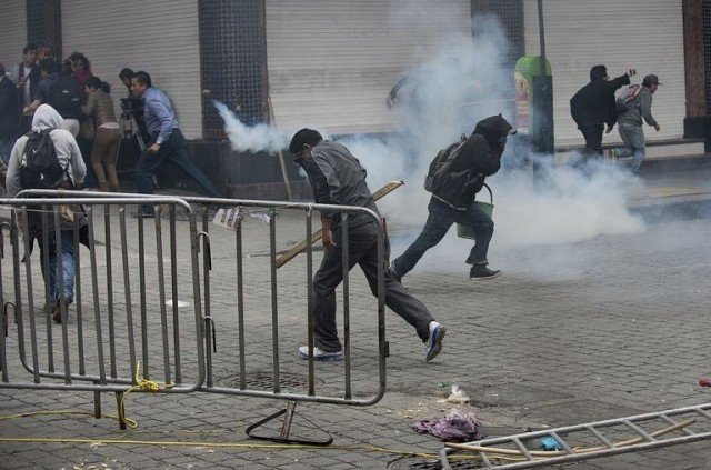 Riot police have clashed with striking teachers during an operation to clear occupied Mexico City’s Zocalo Square