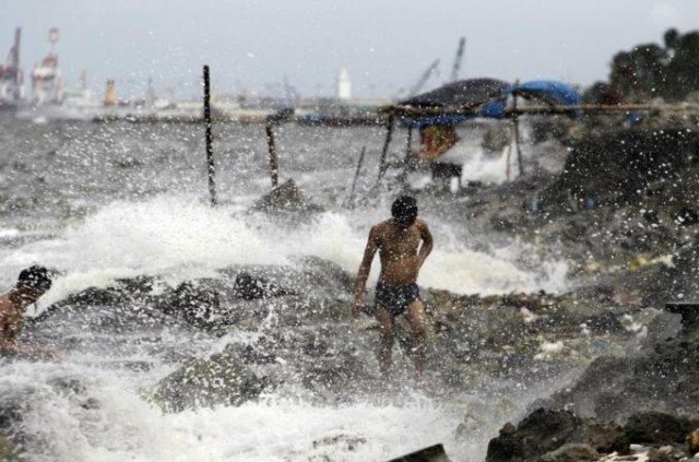 Villages have been evacuated, ferries suspended and flights cancelled in Philippines and Taiwan as Typhoon Usagi goes through the Luzon Strait which divides them