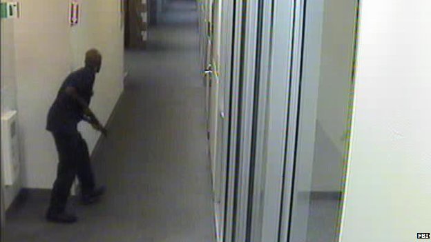Washington DC Navy Yard gunman Aaron Alexis prowling the corridors of the complex as he hunts for victims