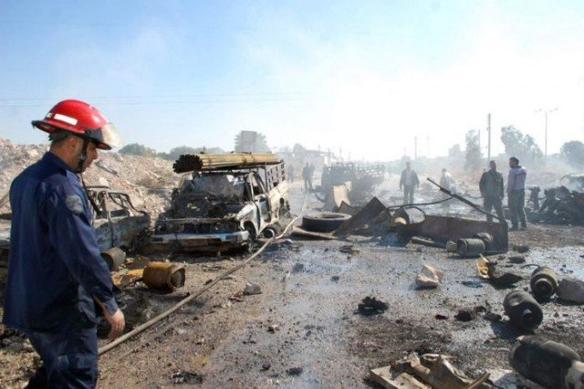 A suicide truck bomb has killed at least 30 people in the central Syrian city of Hama