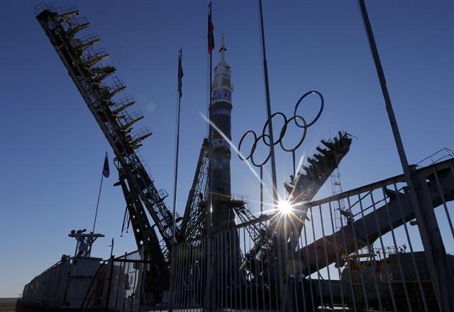 A Soyuz rocket is delivering the Olympic torch to the International Space Station