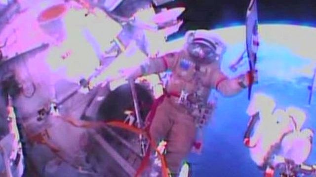 Cosmonauts Oleg Kotov and Sergei Ryazansky are taking the torch for the Sochi Winter Olympics on its first historic spacewalk