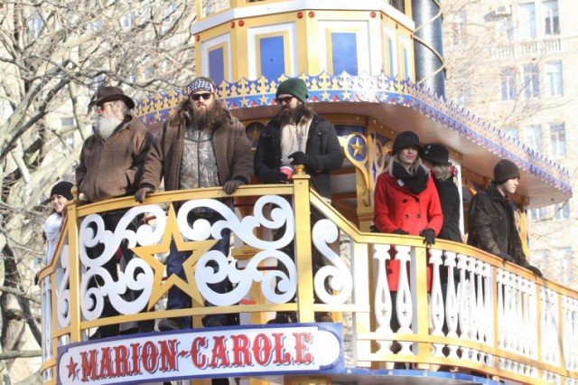 Duck Dynasty stars looked a little bemused as their boat-like float Marion Carole made its way along the route lined by 3.5 million spectators