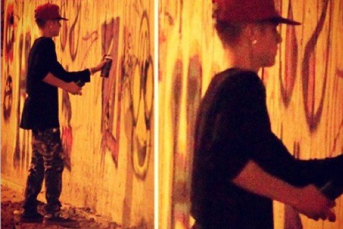 Justin Bieber spray painting the wall of the former Hotel Nacional in Rio de Janeiro 
