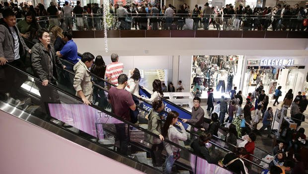 Outbreaks of violence have marred Black Friday shopping frenzy, as bargain-hunters besieged malls across the US