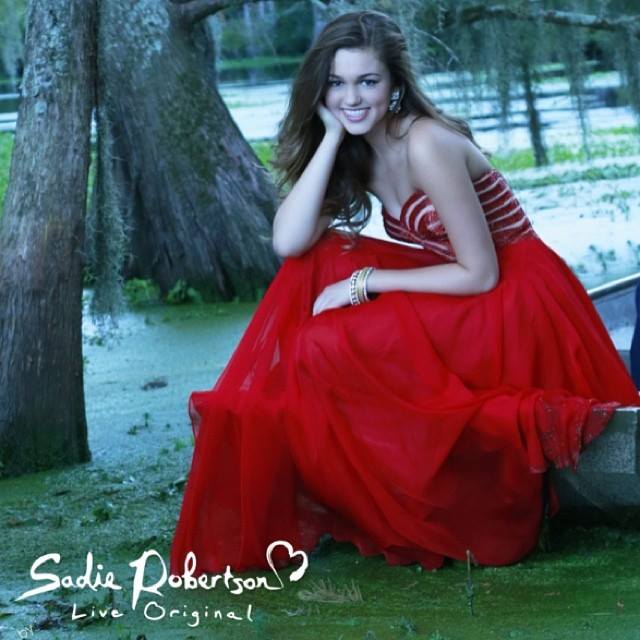Sadie Robertson wears red Live Original by Sherri Hill prom dress 