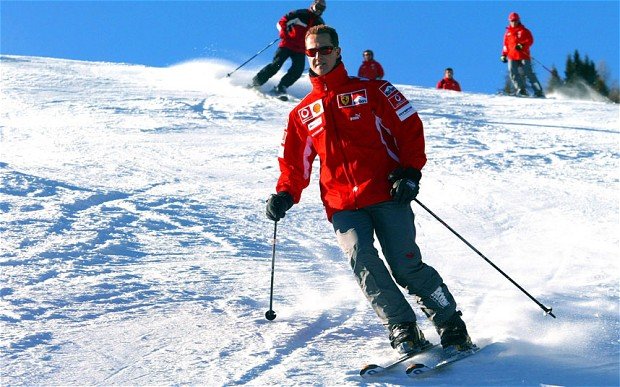 Michael Schumacher's condition has improved slightly after an operation to relieve pressure on his brain