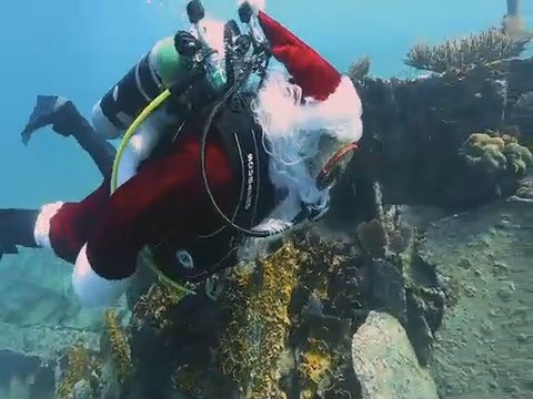 Santa took some time off from getting ready for his annual Christmas toy run to dive amid the marine life in Elbow Reef in the Florida Keys National Marine Sanctuary