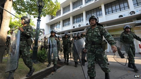 Troops have been deployed in Bangkok to support riot police shielding official buildings from anti-government protesters